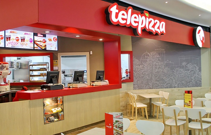 Interior d'un local de Telepizza.